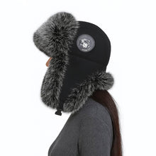 Vintermössa med öronlappar - värme och skydd i kyla Svart